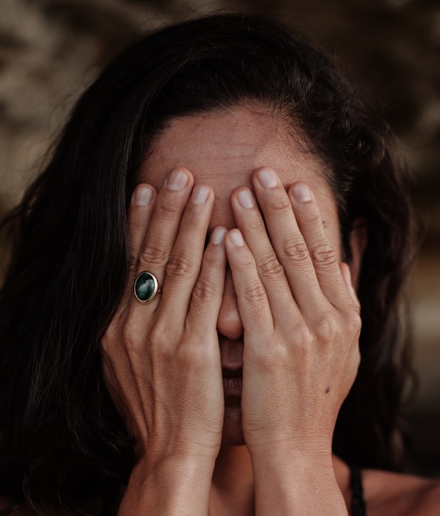 photo-of-woman-covering-her-face-3327126