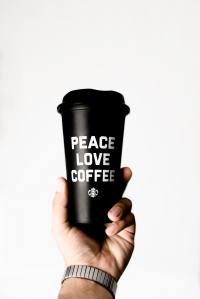 person-holding-starbucks-coffee-tumbler-2744760